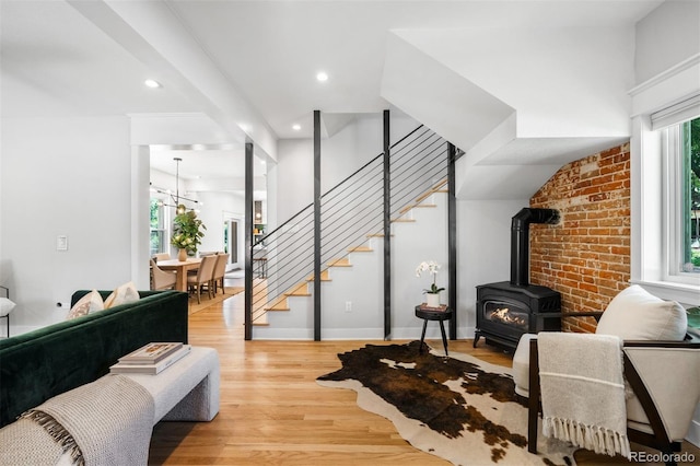 2995 Yates St, Denver, CO 80212 - living area with stairway, light wood-style flooring, a wood stove, and recessed lighting