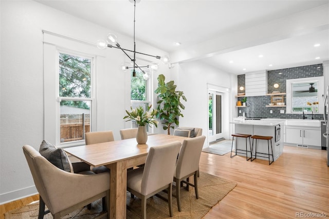 2995 Yates St, Denver, CO 80212 - dining room featuring plenty of natural light, light wood finished floors, a chandelier, and recessed lighting