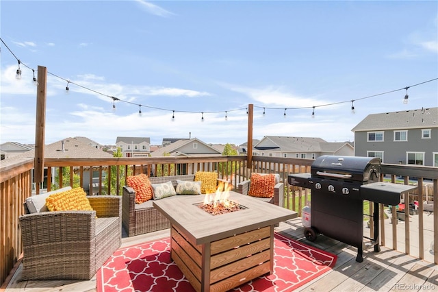 7678 S Old Hammer Way, Aurora, CO 80016 - wooden deck with area for grilling, a residential view, and an outdoor living space with a fire pit