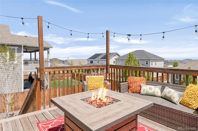 7678 S Old Hammer Way, Aurora, CO 80016 - deck with an outdoor fire pit and a residential view