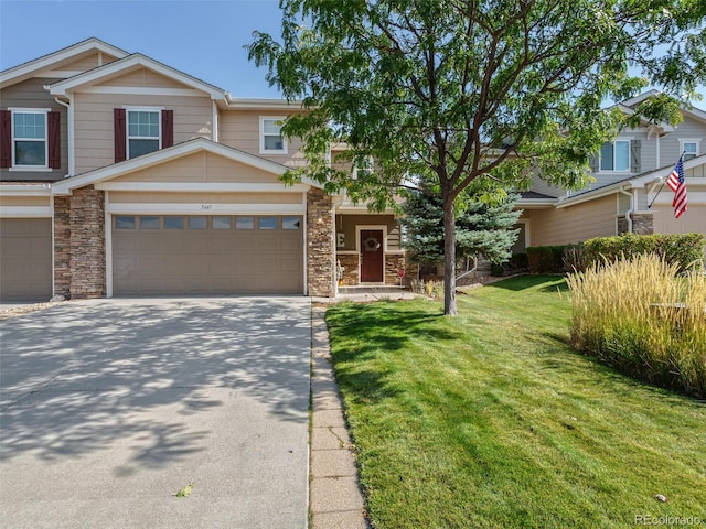 view of front of home with a front lawn and a garage