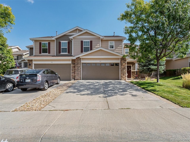 view of front of home featuring a front yard and a garage