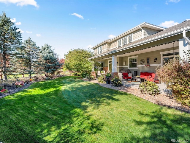 view of yard with a patio area and an outdoor living space