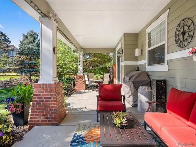 view of patio / terrace featuring grilling area and a porch