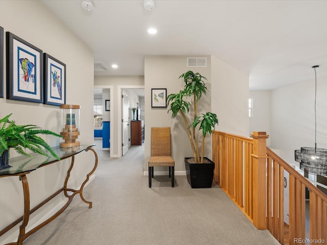 living area featuring light colored carpet