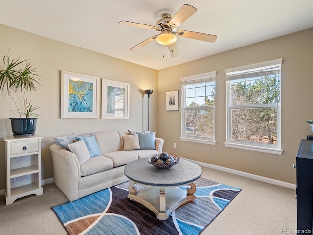 living room with carpet flooring and ceiling fan