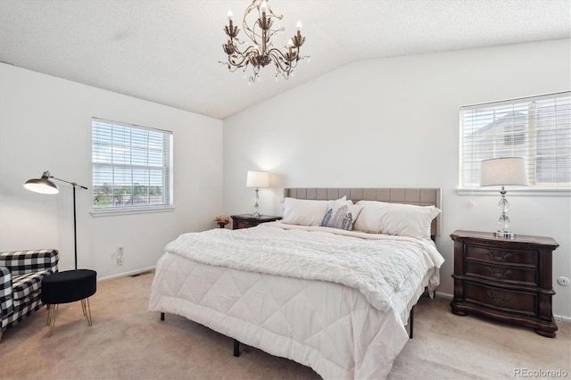 7822 W Ottawa Pl, Littleton, CO 80128 - bedroom with light colored carpet, a chandelier, lofted ceiling, and baseboards