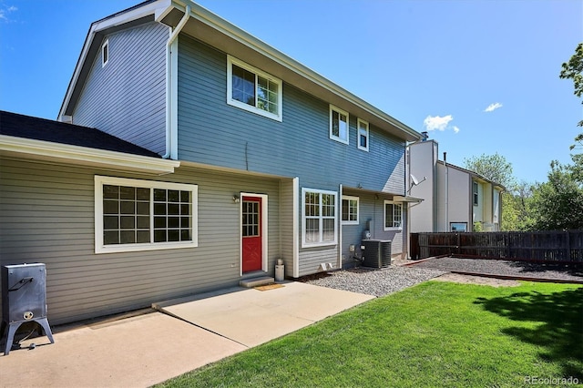 7822 W Ottawa Pl, Littleton, CO 80128 - back of house featuring central AC and a patio