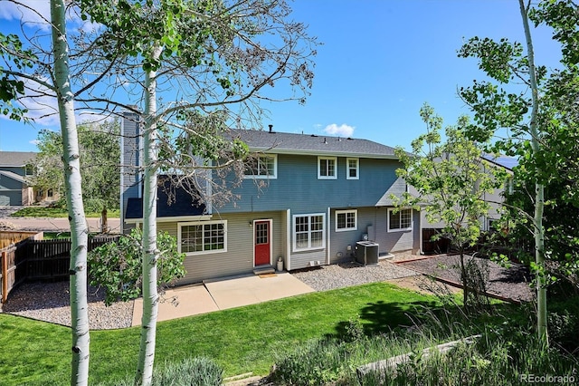 7822 W Ottawa Pl, Littleton, CO 80128 - back of house with a patio and central AC unit
