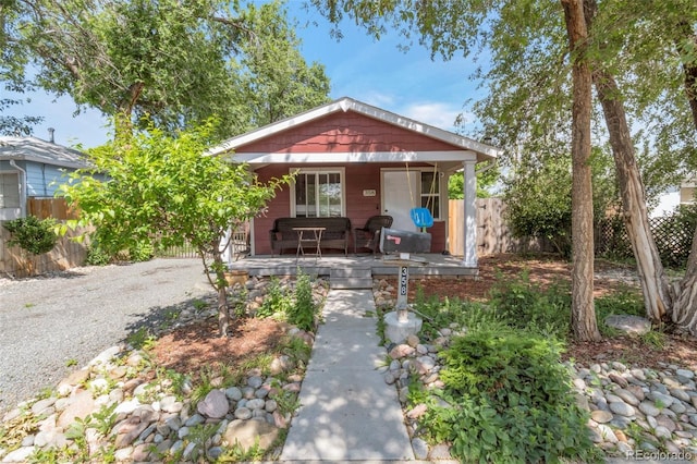358 S Osceola St, Denver, CO 80219 - view of front facade featuring covered porch