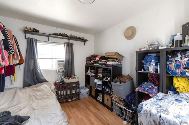 358 S Osceola St, Denver, CO 80219 - bedroom featuring wood finished floors and cooling unit