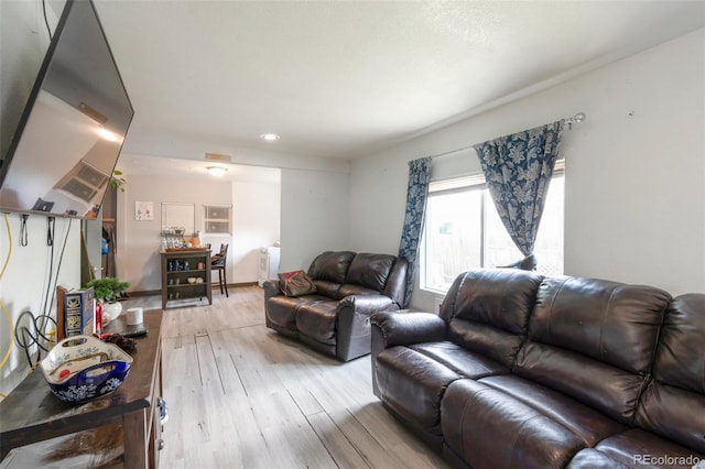 358 S Osceola St, Denver, CO 80219 - living area with light wood-type flooring and washer / clothes dryer