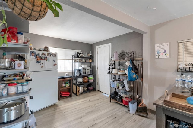 358 S Osceola St, Denver, CO 80219 - kitchen with freestanding refrigerator and light wood finished floors