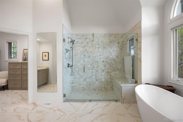 120 Silver Leaf Way, Castle Rock, CO 80108 - bathroom with a freestanding bath, marble finish floors, a stall shower, and vanity
