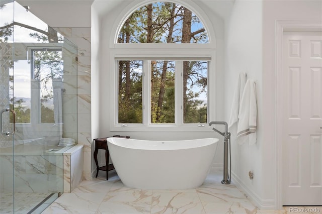120 Silver Leaf Way, Castle Rock, CO 80108 - full bath with marble tiled floors, a freestanding bath, and a marble finish shower