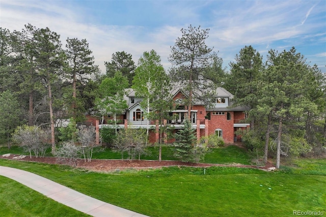120 Silver Leaf Way, Castle Rock, CO 80108 - view of front of home with brick siding and a front yard