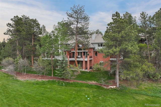 120 Silver Leaf Way, Castle Rock, CO 80108 - back of property with a lawn and brick siding