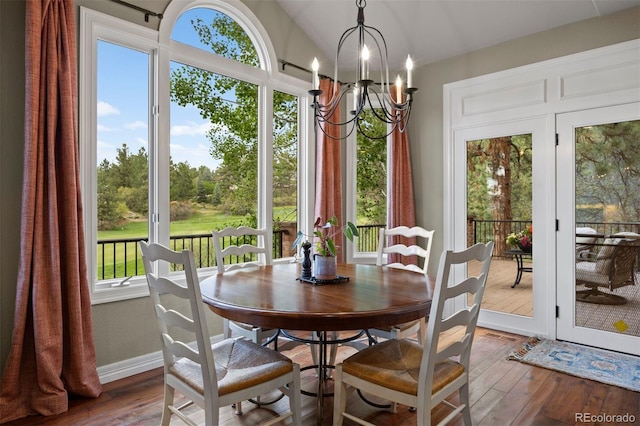120 Silver Leaf Way, Castle Rock, CO 80108 - dining room featuring wood-type flooring, a chandelier, vaulted ceiling, and baseboards