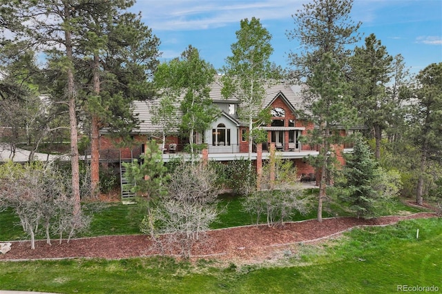 120 Silver Leaf Way, Castle Rock, CO 80108 - back of house featuring a lawn and brick siding