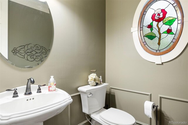 120 Silver Leaf Way, Castle Rock, CO 80108 - half bath featuring a sink, toilet, and baseboards