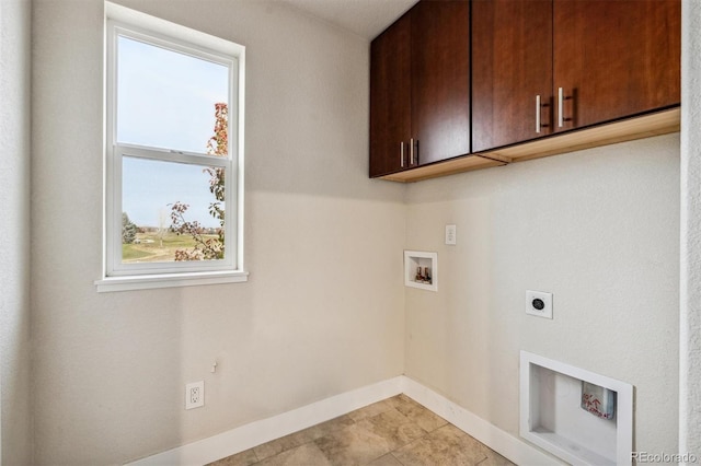 laundry area with cabinets, washer hookup, light tile patterned floors, and electric dryer hookup