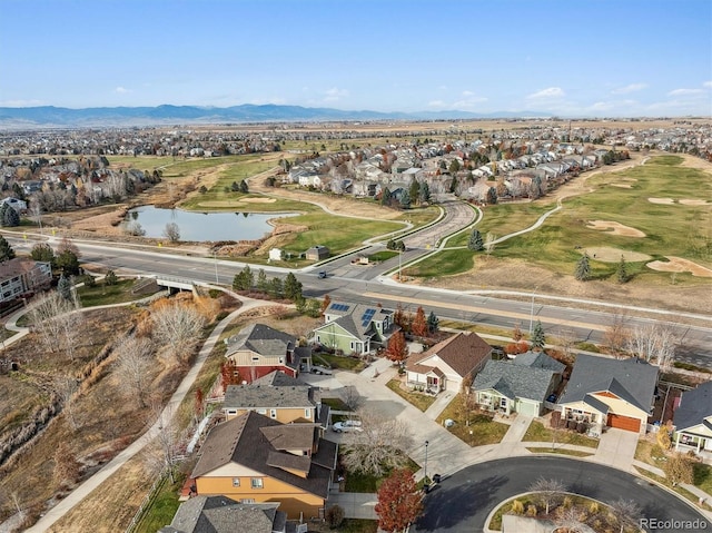 drone / aerial view with a water and mountain view