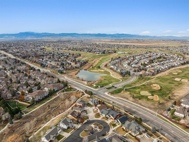 aerial view featuring a water and mountain view