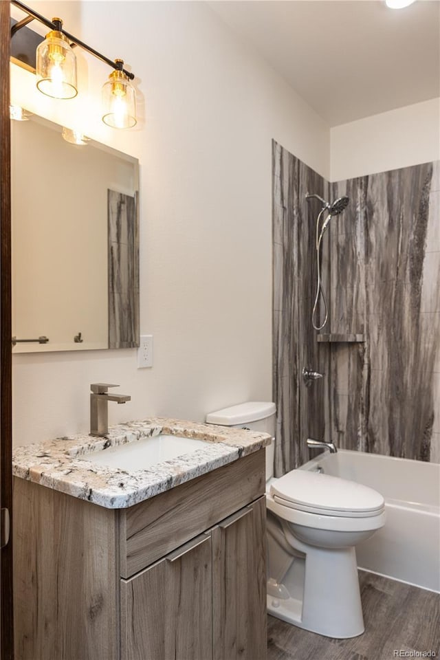 104 Dotson St, Manassa, CO 81141 - full bathroom featuring vanity, wood finished floors, and shower / washtub combination