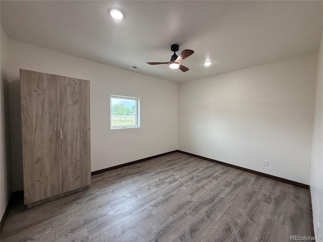 104 Dotson St, Manassa, CO 81141 - empty room with a ceiling fan and wood finished floors