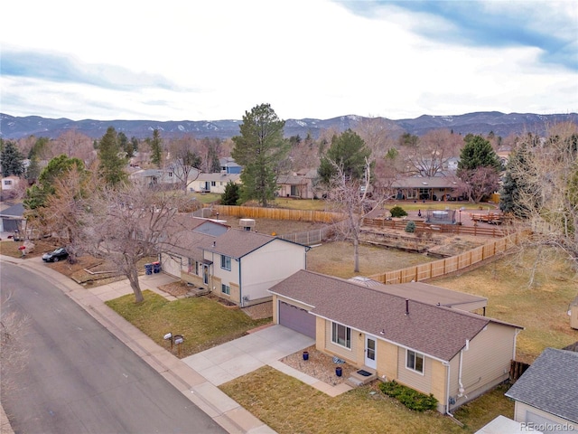 drone / aerial view with a mountain view and a residential view