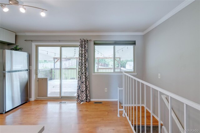 6523 S Field Way, Littleton, CO 80123 - interior space with light wood-style flooring and ornamental molding