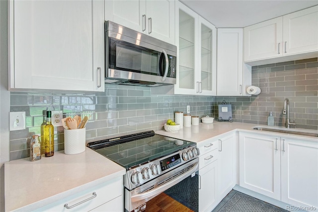 6523 S Field Way, Littleton, CO 80123 - kitchen featuring stainless steel appliances, white cabinetry, and light countertops