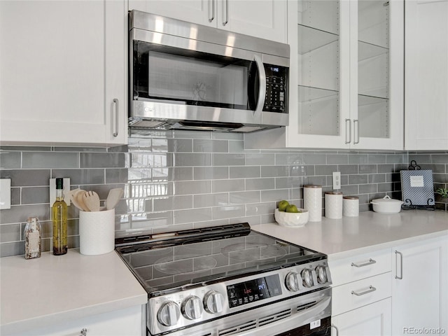 6523 S Field Way, Littleton, CO 80123 - kitchen with stainless steel appliances, white cabinetry, and light countertops