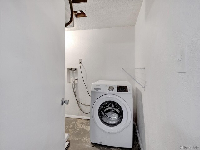 6523 S Field Way, Littleton, CO 80123 - laundry room featuring washer / clothes dryer, baseboards, and a textured ceiling