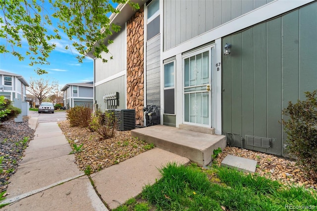 property entrance with central AC unit