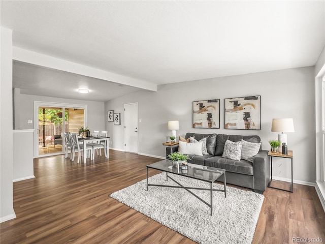 5995 Estes St, Arvada, CO 80004 - living room with wood finished floors, baseboards, and beam ceiling