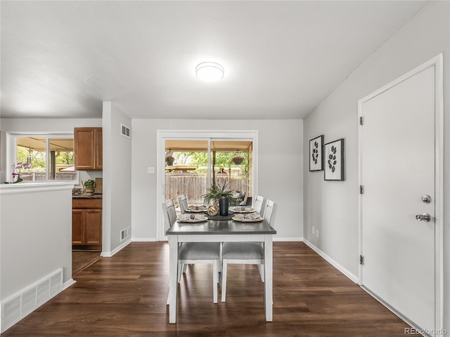 5995 Estes St, Arvada, CO 80004 - dining area with healthy amount of natural light, dark wood finished floors, and baseboards