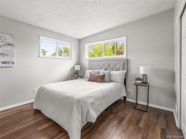 5995 Estes St, Arvada, CO 80004 - bedroom with baseboards, wood finished floors, and a textured ceiling