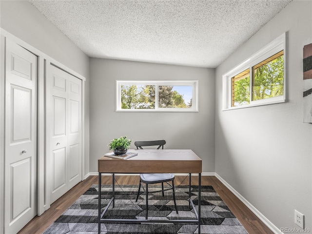 5995 Estes St, Arvada, CO 80004 - home office featuring a textured ceiling, dark wood finished floors, and baseboards