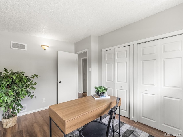 5995 Estes St, Arvada, CO 80004 - home office with wood finished floors, a textured ceiling, and baseboards