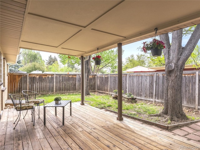 5995 Estes St, Arvada, CO 80004 - wooden terrace with a fenced backyard