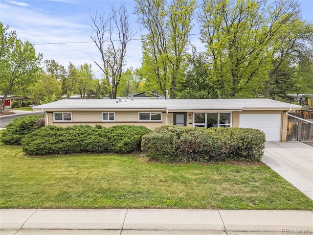 5995 Estes St, Arvada, CO 80004 - ranch-style home with a garage, driveway, and brick siding
