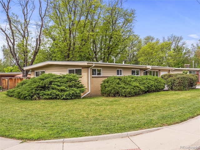 5995 Estes St, Arvada, CO 80004 - ranch-style house featuring a front lawn and brick siding