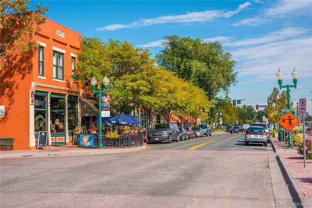 5995 Estes St, Arvada, CO 80004 - view of asphalt road with sidewalks, street lights, curbs, and traffic lights