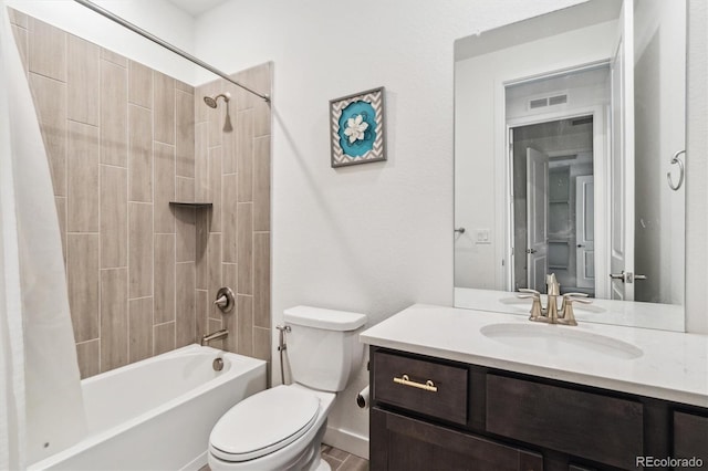 bathroom featuring toilet, visible vents, shower / bath combo with shower curtain, and vanity