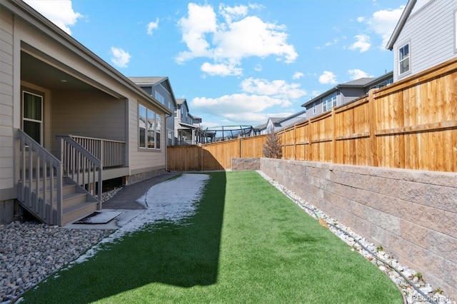 view of yard with fence private yard and a residential view