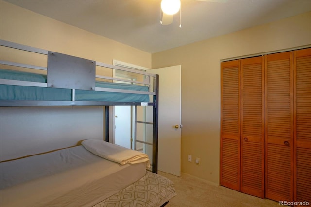 unfurnished bedroom featuring carpet floors, a closet, and ceiling fan