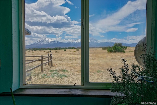 view of yard featuring a rural view and a mountain view