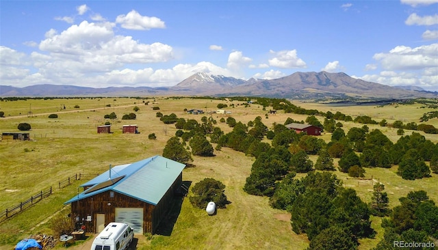 birds eye view of property with a mountain view and a rural view