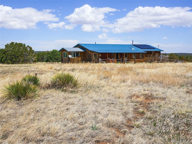 exterior space featuring roof mounted solar panels